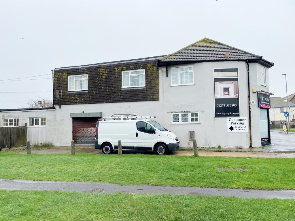 Lot: 85 - TWO FREEHOLD SHOPS PLUS WORKSHOP AND TWO FLATS ABOVE - Side view of 36 wuith driveway